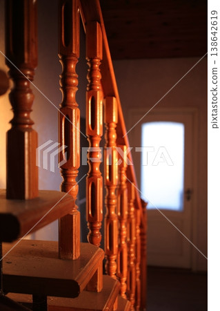 A wooden staircase in the rays of the rising sun. A wooden staircase in the rays of the rising sun. 138642619
