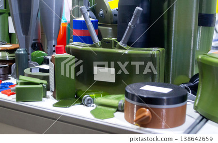 Models of military ammunition anti-personnel mine printed on 3D printer. 3D-printed military ammunition mock-ups. Prototype of ammunition printed on 3D printer. Innovation modern additive technologies 138642659
