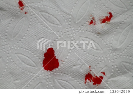 Red blood on tissue toilet paper. 138642959