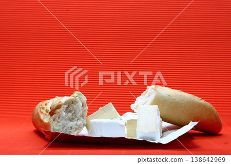 Still life with brie cheese and baguette. Still life with brie cheese and baguette. 138642969