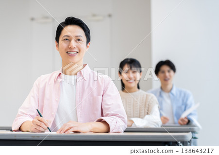 A middle-aged man attending a seminar. Photo courtesy of Denpa Gakuen Educational Foundation, Tokyo Electronics College. A middle-aged man attending a seminar. Photo courtesy of Denpa Gakuen Educational Foundation, Tokyo Electronics College. 138643217
