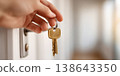 Hand, keys and a house entrance background. Home owner proud of their real estate property purchase. Mortgage, beginning, new apartment. Classic investment, beginnings, home ownership, and success. 138643350