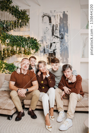 Family gathering in a modern living room during the holiday season Family gathering in a modern living room during the holiday season 138644100