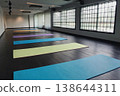 Fitness gym interior, yoga mats and gym equipment lying on floor. AI Generative 138644311