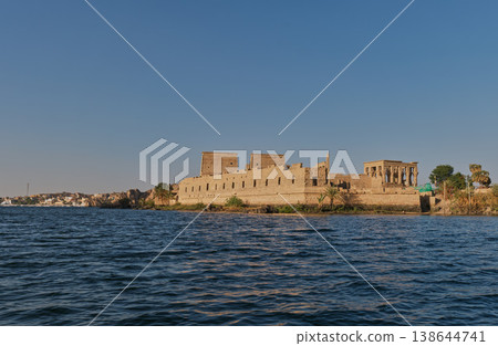 The Temple of Philae (Aswan, Egypt) viewed across the Nile River. The Temple of Philae (Aswan, Egypt) viewed across the Nile River. 138644741