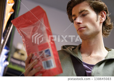 Man, product or label information in grocery store or nutrition value, choice or customer decision. Male person, thinking or read protein or calories search in package, purchase direction or benefits 138645083
