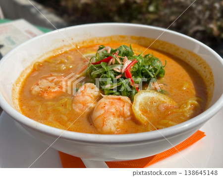 Laksa noodles, a Chinese noodle dish with shrimp and green onions. Laksa noodles, a Chinese noodle dish with shrimp and green onions. 138645148
