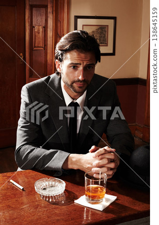 Portrait, thinking and man with whiskey, relax and bar with ideas, ashtray and glass with cigarette. Person, gentleman and smoker with alcohol, tobacco and wonder with peace, nicotine and thoughts Portrait, thinking and man with whiskey, relax and bar with ideas, ashtray and glass with cigarette. Person, gentleman and smoker with alcohol, tobacco and wonder with peace, nicotine and thoughts 138645159