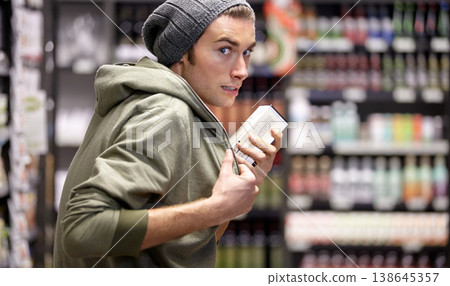 Man, criminal or steal or food in supermarket crime, poverty or hungry homeless sneak. Male person, thief or hide product or shoplifting in grocery shopping store for addiction money, sell or secret Man, criminal or steal or food in supermarket crime, poverty or hungry homeless sneak. Male person, thief or hide product or shoplifting in grocery shopping store for addiction money, sell or secret 138645357