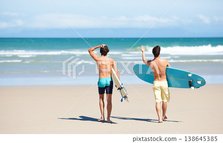 Surf, walking and beach sports people, friends or men travel on sand to ocean waves, sea water or nature mockup. Surfboard, surfing partner and back of surfer for vacation, wellness and adventure Surf, walking and beach sports people, friends or men travel on sand to ocean waves, sea water or nature mockup. Surfboard, surfing partner and back of surfer for vacation, wellness and adventure 138645385