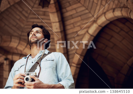 Thinking, photographer or tourist in building on holiday, vacation or weekend trip for an adventure in Italy. Man, city travel or low angle of person with camera sightseeing in urban town on journey Thinking, photographer or tourist in building on holiday, vacation or weekend trip for an adventure in Italy. Man, city travel or low angle of person with camera sightseeing in urban town on journey 138645510