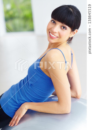 Exercise ball, pilates portrait and happy woman relax after yoga routine, fitness or wellness workout. Happiness, smile and studio person rest after sports training, aerobics or cardio challenge Exercise ball, pilates portrait and happy woman relax after yoga routine, fitness or wellness workout. Happiness, smile and studio person rest after sports training, aerobics or cardio challenge 138645519