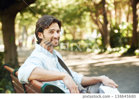 Relax, portrait or happy man in park on a bench in summer for fresh air, holiday vacation or break in garden. Confident, smile or calm person in nature resting or waiting in a natural environment Relax, portrait or happy man in park on a bench in summer for fresh air, holiday vacation or break in garden. Confident, smile or calm person in nature resting or waiting in a natural environment 138645680