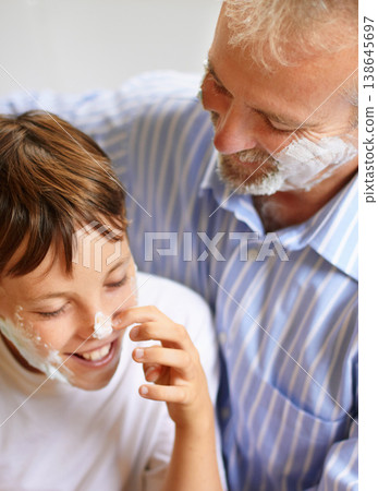 Father, son and face with shaving cream and smile for grooming for development and learning at home. Happy family, man and child with foam or aftershave for hygiene, lifestyle or parenting with love 138645697