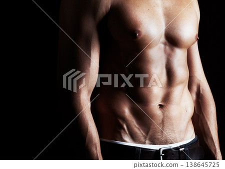 Closeup, muscle and man with fitness, sexy and bodybuilding on a dark studio background. Healthy person, model and guy with abs, stomach or exercise with workout, wellness and health with aesthetic Closeup, muscle and man with fitness, sexy and bodybuilding on a dark studio background. Healthy person, model and guy with abs, stomach or exercise with workout, wellness and health with aesthetic 138645725