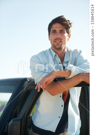 Freedom, portrait and man in car on road trip at door, travel and desert adventure for summer vacation. Transport, holiday journey and calm person standing at van in nature, sunshine and countryside. 138645814