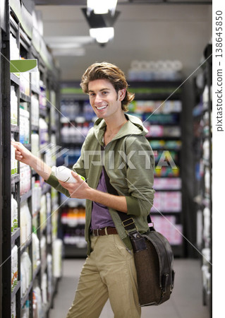 Man, smile or grocery store for product shopping, household supplies or purchase choice. Male person, happy or supermarket shelf for produce wholesale discount prices, budget decision or buy browsing 138645850