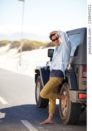 Road trip, travel and man waiting for car help, support or service on road journey, summer adventure or street transportation. Automobile break, patience and person leaning on SUV, van or vehicle 138645851