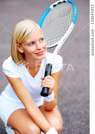 Tennis, woman and thinking with racket outdoor for training, contest and performance in competition. Happy young athlete, sports player and kneeling to daydream with bat for tournament game on court Tennis, woman and thinking with racket outdoor for training, contest and performance in competition. Happy young athlete, sports player and kneeling to daydream with bat for tournament game on court 138645852