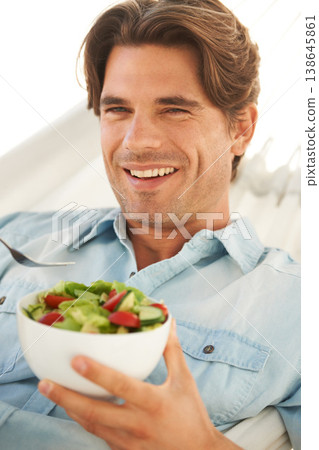 Portrait, man and smile while eating salad for detox, clean diet and to lose weight at home. Happy guy with bowl of healthy food, nutrition and vegan benefits for digestion, wellness and lunch meal Portrait, man and smile while eating salad for detox, clean diet and to lose weight at home. Happy guy with bowl of healthy food, nutrition and vegan benefits for digestion, wellness and lunch meal 138645861