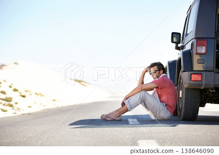 Problem, desert and man at car on road trip with emergency, travel and desert adventure for vacation. Transport, stress on journey and driver waiting on floor at van with breakdown, suv and relax. Problem, desert and man at car on road trip with emergency, travel and desert adventure for vacation. Transport, stress on journey and driver waiting on floor at van with breakdown, suv and relax. 138646090