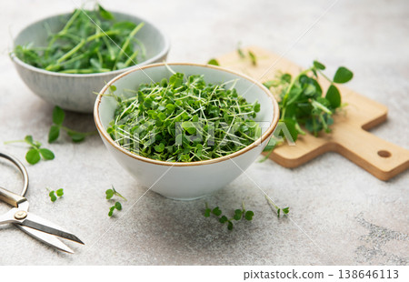 Fresh green microgreens in bowls for healthy eating 138646113