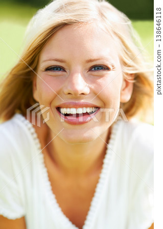 Happy woman, face and portrait in nature for summer vacation, break or outdoor holiday at park. Female person or blonde smile in happiness for sunshine, joy or freedom in relax or natural environment 138646118