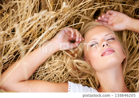 Relax, freedom and woman lying on wheat field outdoor for adventure, journey or travel experience from above. Top view, face and female person with eyes closed resting in grass with stress free peace Relax, freedom and woman lying on wheat field outdoor for adventure, journey or travel experience from above. Top view, face and female person with eyes closed resting in grass with stress free peace 138646205