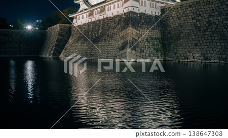Architecture - Osaka Castle Stone Walls and Moat Reflected in Dark Water at Night Illuminated Light 138647308