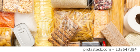 Canned goods, cereals, and pasta stored for quarantine and isolation, ensuring long-term survival and food security at home, survival during military operations, the concept of stay at home, banner Canned goods, cereals, and pasta stored for quarantine and isolation, ensuring long-term survival and food security at home, survival during military operations, the concept of stay at home, banner 138647384
