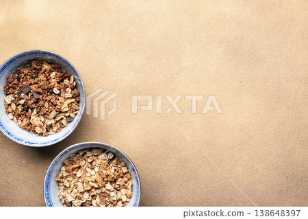 Healthy breakfast background with granola bowls Healthy breakfast background with granola bowls 138648397