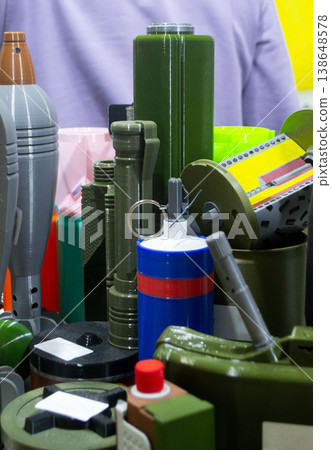 Models of various types of weapons, with RGN hand grenade printed on 3D printer. Prototype of ammunition printed on 3D printer. Innovation new modern additive technologies. 3D printing technology Models of various types of weapons, with RGN hand grenade printed on 3D printer. Prototype of ammunition printed on 3D printer. Innovation new modern additive technologies. 3D printing technology 138648578