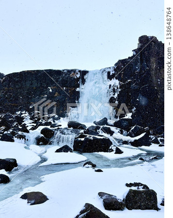 Frozen Oxararfoss waterfall in Thingvellir National Park during winter, Iceland. Frozen Oxararfoss waterfall in Thingvellir National Park during winter, Iceland. 138648764