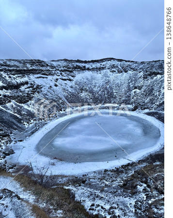 Frozen volcanic crater lake Kerid in winter landscape, Iceland. Frozen volcanic crater lake Kerid in winter landscape, Iceland. 138648766