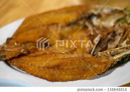 Deep fried Sea bass with Fish Sauce served on plate Deep fried Sea bass with Fish Sauce served on plate 138648818