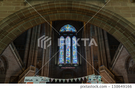 the towering interior of the Cathedral Church of Christ in Liverpool, framed by one of its signature wide sandstone arches. As the largest Anglican cathedral in Britain. 138649166
