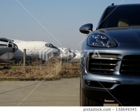 White aircrafts behind the passenger vehicle at the airport White aircrafts behind the passenger vehicle at the airport 138649345