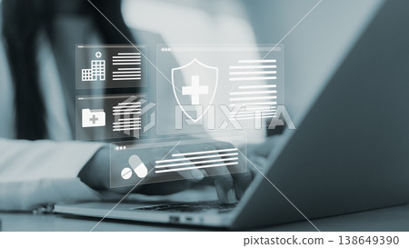 Health insurance online and medical records technology.Digital healthcare management system with laptop.Secure online medical data solution.Woman hands working on medical insurance policy. Health insurance online and medical records technology.Digital healthcare management system with laptop.Secure online medical data solution.Woman hands working on medical insurance policy. 138649390