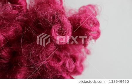 Macro shot of chaotically intertwined pink thread-like fibers Macro shot of chaotically intertwined pink thread-like fibers 138649450