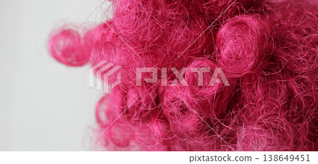 Strands of tangled pink artificial hair extreme close up image Strands of tangled pink artificial hair extreme close up image 138649451