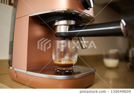 Close-up making coffee at the coffee machine Close-up making coffee at the coffee machine 138649609
