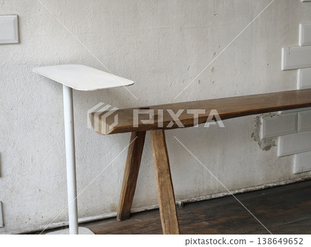 Minimalist Interior Rustic Wooden Bench and White Pedestal Table Minimalist Interior Rustic Wooden Bench and White Pedestal Table 138649652
