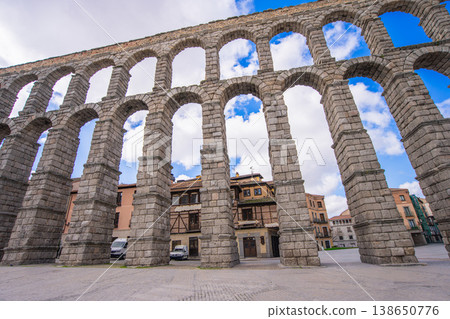 Ancient Roman Aqueduct of Segovia, Spain under a Blue Sky Ancient Roman Aqueduct of Segovia, Spain under a Blue Sky 138650776
