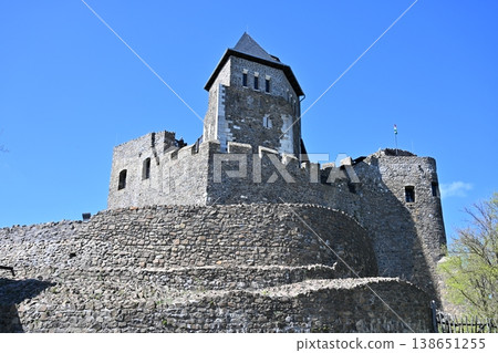 Medieval stone castle with high tower under clear blue sky Medieval stone castle with high tower under clear blue sky 138651255