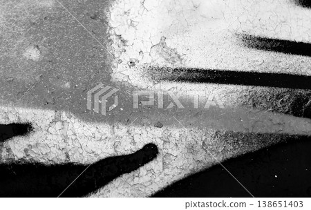 Black and white graffiti elements on a weathered wall with bold lines, abstract photo Black and white graffiti elements on a weathered wall with bold lines, abstract photo 138651403