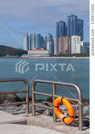 Busan, South Korea. Haeundae beach view. An orange lifebuoy Busan, South Korea. Haeundae beach view. An orange lifebuoy 138651408