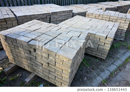 Stacks of Concrete Paving Stones on Pallets at Construction Site Stacks of Concrete Paving Stones on Pallets at Construction Site 138651443
