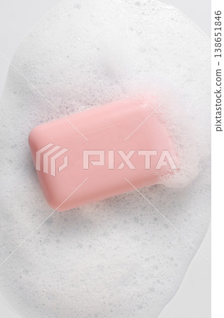 Pink soap with foam on a white background. Pink soap with foam on a white background. 138651846