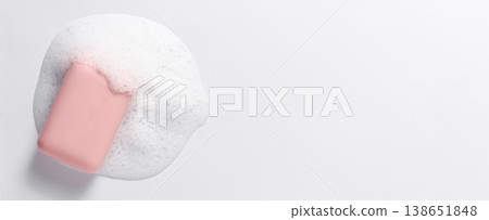 Pink soap with foam on a white background. Copy space Pink soap with foam on a white background. Copy space 138651848