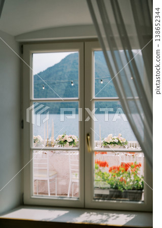 Inviting Interior Capturing Tranquil Morning With Floral Balcony Decor And Mountain Scenery 138652344